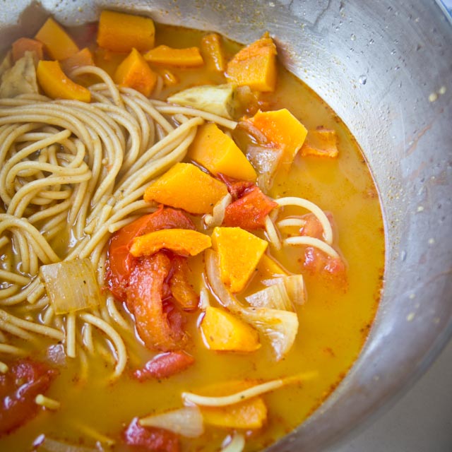 Sweet, spicy, sour noodle soup with tomatos, sweet potato, and butternut squash
